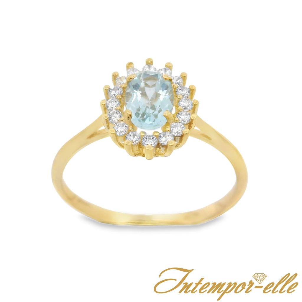 Bague entourage ( Halo ) or jaune 18K avec topaz bleu et zircon serti griffes or jaune 18K
