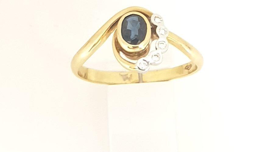 # Bague or jaune et or blanc avec saphir et 0.05ct diamants