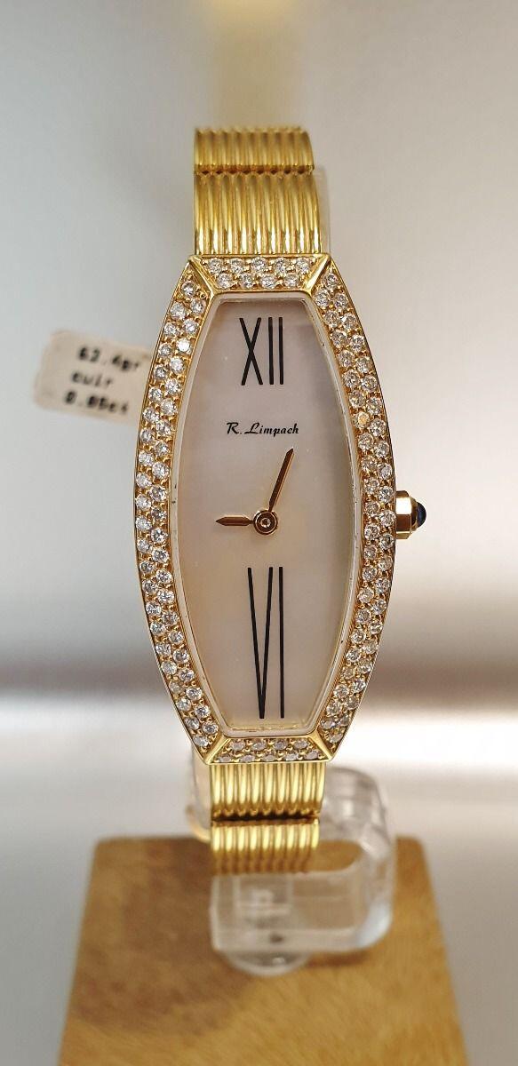 # Montre dame en or jaune 63.4gr ovale forme tonneau,  18ct,  cadran nacre, faite main dans nos ateliers, sertie de diamants brillants 0.85ct, 18*36mm
